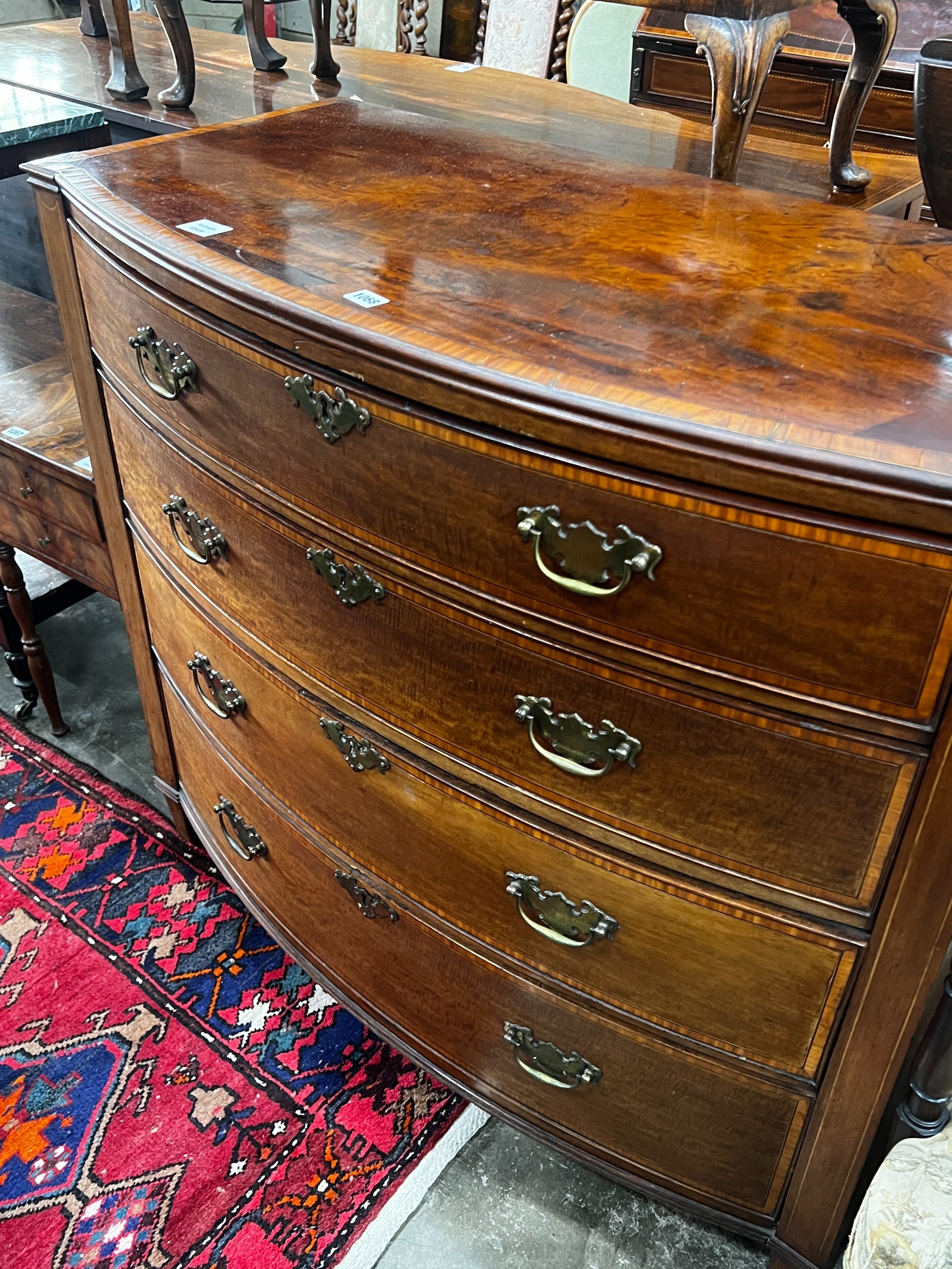 A George III satinwood banded mahogany bow front chest of drawers, width 109cm, depth 54cm, height 101cm